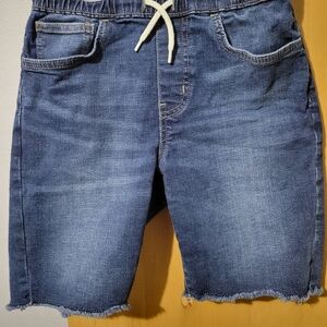 Like new Old Navy blue jean shorts with fringe ends, draw string waist